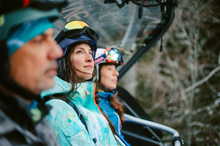 Woman sits on ski lift