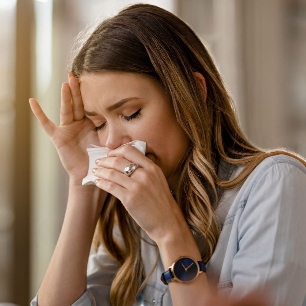 Woman with allergies at laptop; ?>